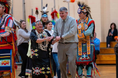 Dr. Black participating in powwow