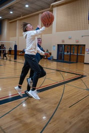 AMS students playing basketball