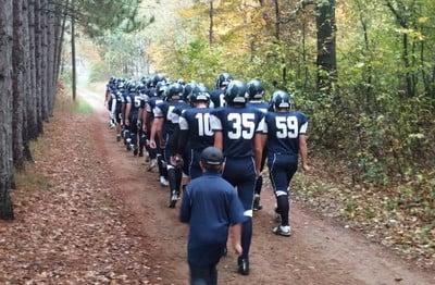 Football team walking to field