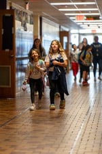 Students walking down hallway