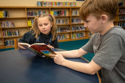 AMS students reading in library