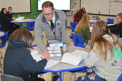 Teacher helping student with question